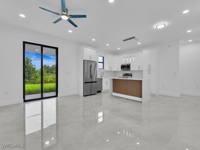 Kitchen featuring stainless steel appliances, base