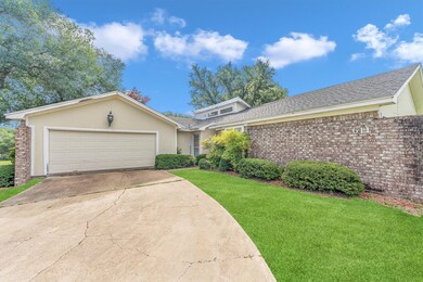 This is a single-story, brick-front home featuring