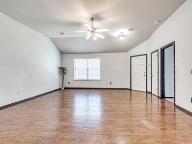 Spare room featuring baseboards, visible vents, lo