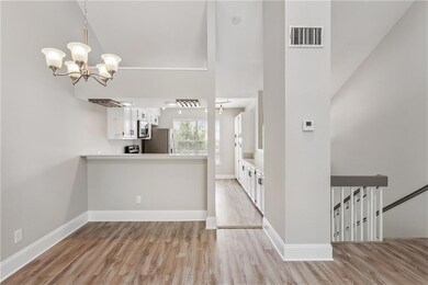 View of Kitchen and Dining Room And to the Downsta