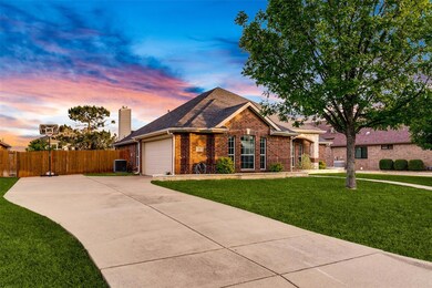 View of front of property featuring a garage, cent