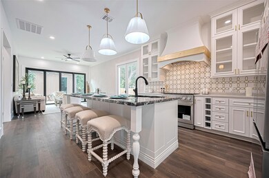 This photo showcases a modern kitchen with a spaci