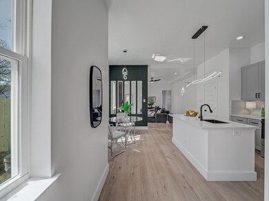 Kitchen featuring light countertops, a ceiling fan
