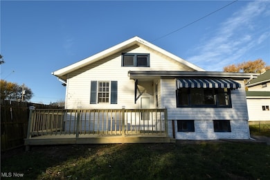 Rear view of property with a deck