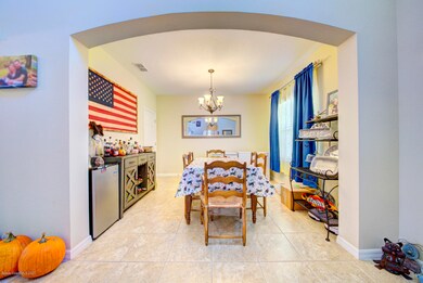 dining room with arched opening