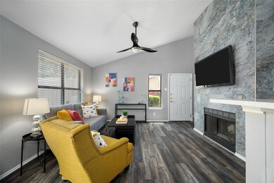 Living room with ceiling fan, vaulted ceiling, dar