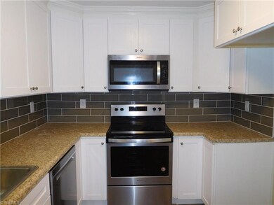 New Stainless Steel dishwasher, built-in Microwave & freestanding range oven.  There is ample counter & cabinet space.