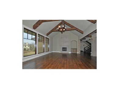 Family Rm with vaulted ceiling, stone columns & di