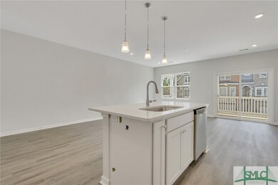 Open layout kitchen, dining, and living room. Phot