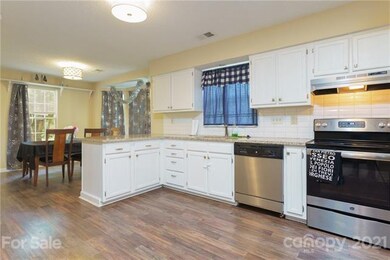 lovely kitchen with granite countertops with break