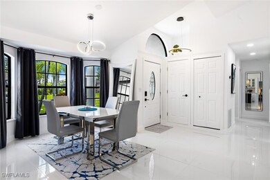 Tiled dining area with an inviting chandelier