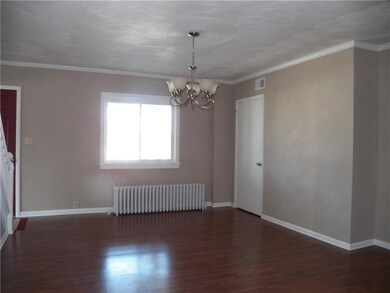 Dining room with crown molding and new lighting