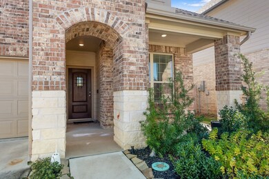 Beautiful stone and brick work enhances the front porch and entry.