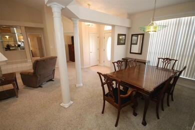 room with columns & plant ledge.