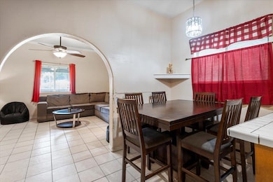Dining area with light tile patterned flooring, a