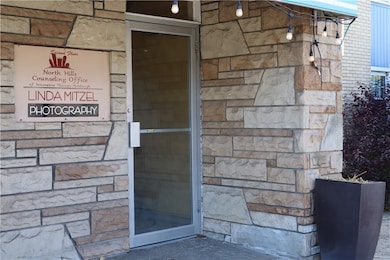 The entrance to the 2nd floor is located at the front of the building.