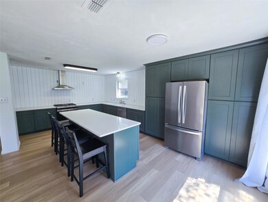 Kitchen featuring light hardwood / wood-style floo