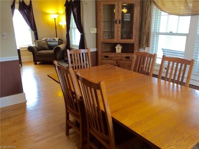 Semi-formal oak floor dining room off the kitchen 