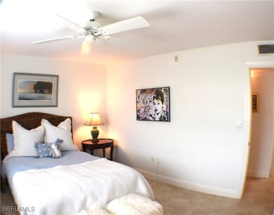 Guest bedroom featuring tiled floor and ceiling fa