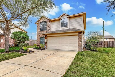The 2-car garage with a double driveway has room t