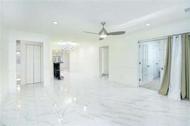 Empty room with crown molding and ceiling fan with