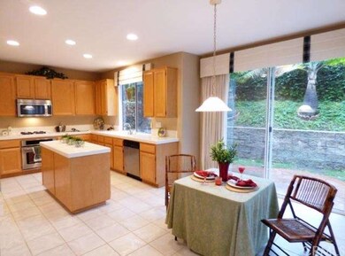 Informal dining area open to the kitchen and famil