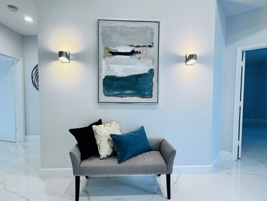 Light and bright entrance with volume ceilings.