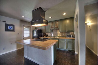 Kitchen has door to covered back patio
