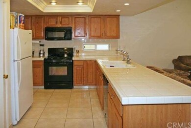 Tiled Kitchen Open to Family Room
