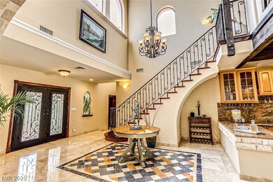 Enter through the wrought iron scrollwork double-d