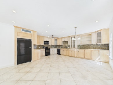 Spectacular Eat-in Kitchen! Tons of Cabinets, Glass Front Doors & Matching Granite Countertops and Granite Backsplash