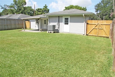 Back yard from corner showing back yard access gate