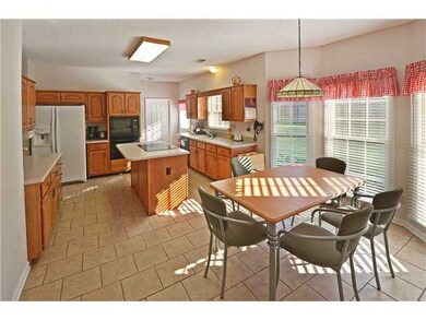 It is a happy kitchen! bright light , views to bac