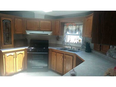 Exterior Front. Large Kitchen & Skylights