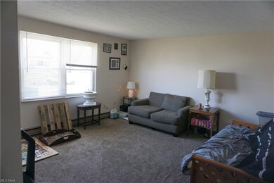 Living room in upper unit 1431.  Nicely maintained