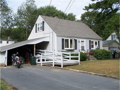Exterior Front. Large carport, paved...