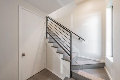 Stairway with dark hardwood / wood-style flooring