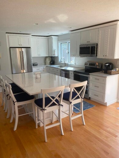 Kitchen w/marble counters & stainless appliances