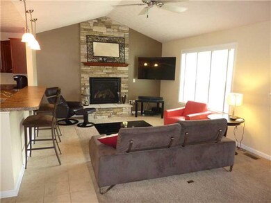 Family Room. Relax in front of the stone fireplace