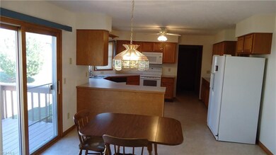 large kitchen, eating area, view of deck and back yard