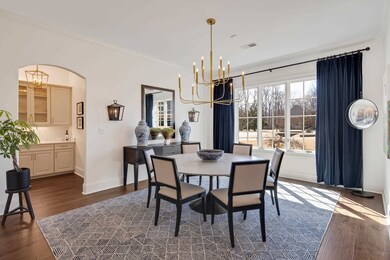 Dining space featuring a notable chandelier, visib