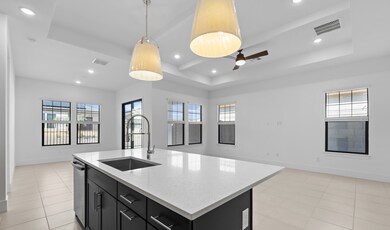 Kitchen with white quartz countertops & island
