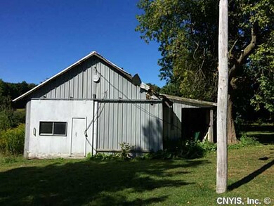 Outbuilding. Pole Barn-Aluminum siding front view.