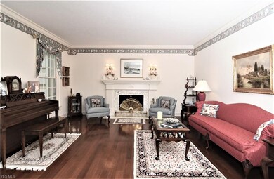 The living room is off the foyer directly across f
