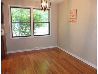 Dining room is open to the kitchen and has bamboo 