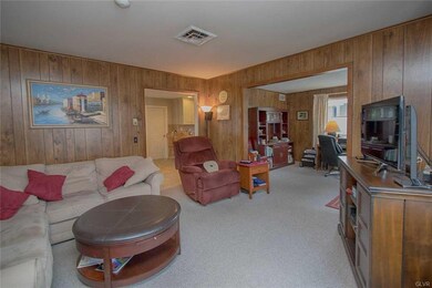 Family room open to kitchen area and den/ office/ 