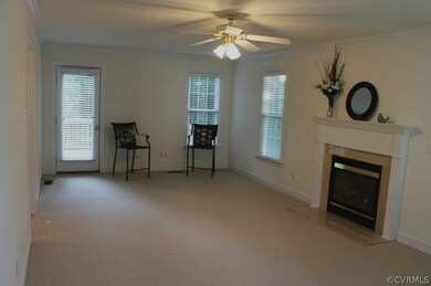 GREAT ROOM BOASTS GAS FIREPLACE WITH BEAUTIFUL MAN