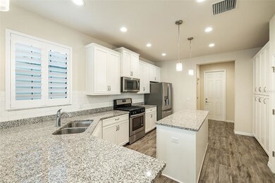 Granite countertops, white cabinets and subway til