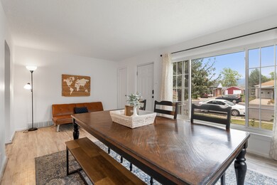 Dining area with light wood-style floors and baseboards
