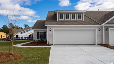 View of front facade with concrete driveway, a front yard, and roof with shingles
